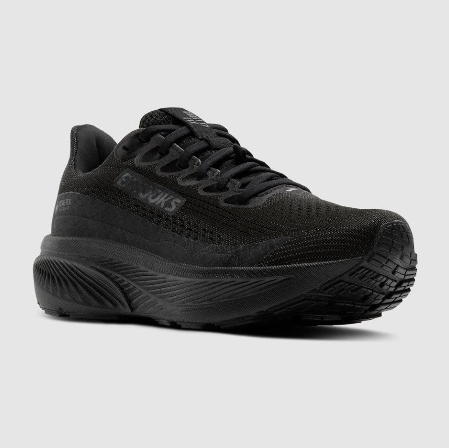 Black running shoe on a light gray background