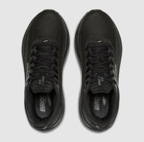 Black running shoes with 'Brooks' branding on a light gray background