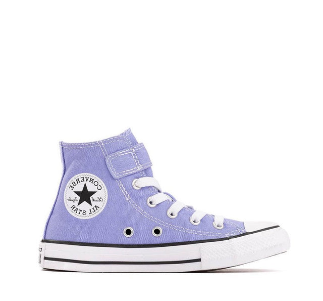 A single Converse All Star high-top sneaker in light purple canvas with white laces, a white rubber toe cap and midsole, and a black circular ankle patch.