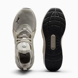 Gray athletic shoe with black sole on a white background