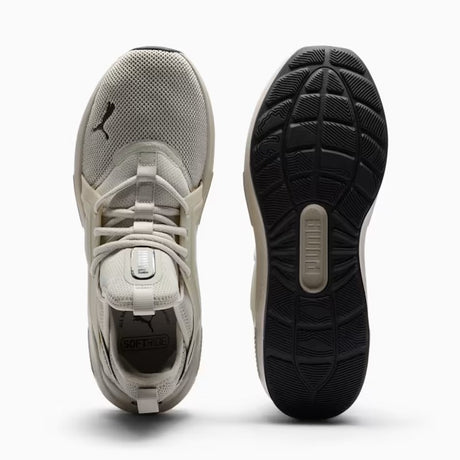 Gray athletic shoe with black sole on a white background