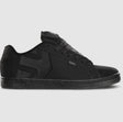 Black sneaker with brand logo on a gray background
