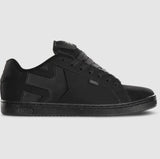 Black sneaker with brand logo on a gray background