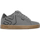 Gray sneaker with brown sole on a light gray background