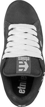 Black and white sneaker with 'etnies' branding on a white background