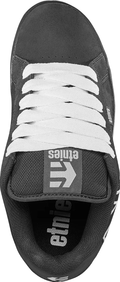 Black and white sneaker with 'etnies' branding on a white background