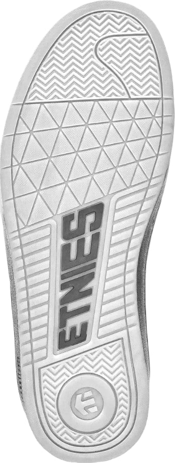 Close-up of a shoe sole with 'Etnies' branding on a white background