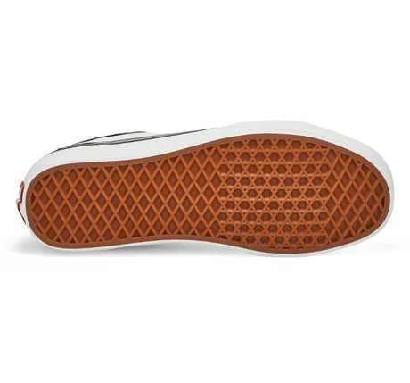 Close-up of a shoe sole with brown pattern on a white background