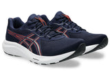 Navy running shoes with red accents on a white background