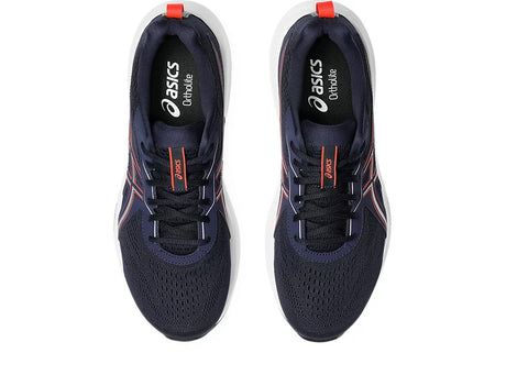 Navy running shoes with red accents on a white background