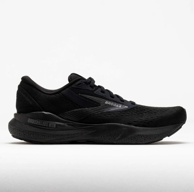 Black running shoe with 'Brooks' branding on a white background