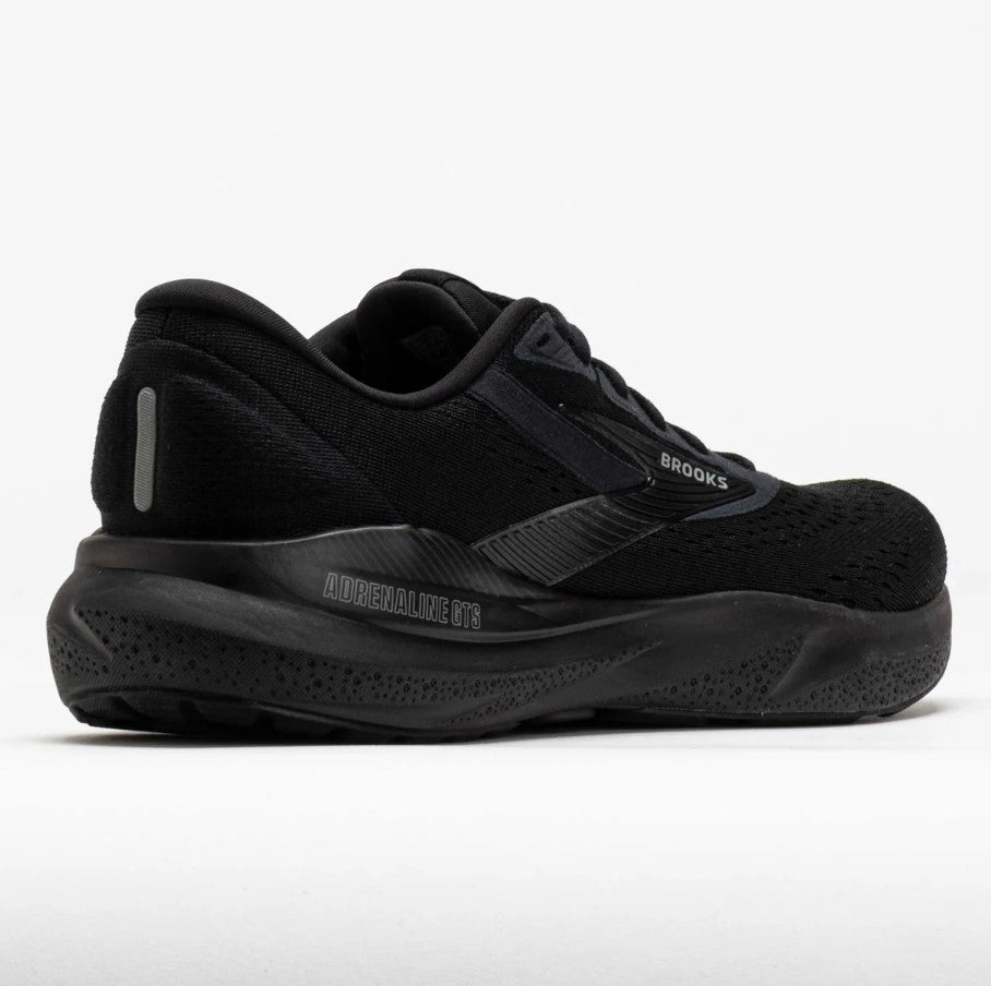 Black running shoe with visible branding on a white background