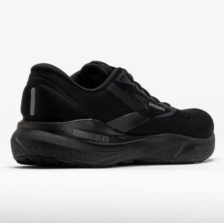 Black running shoe with visible branding on a white background