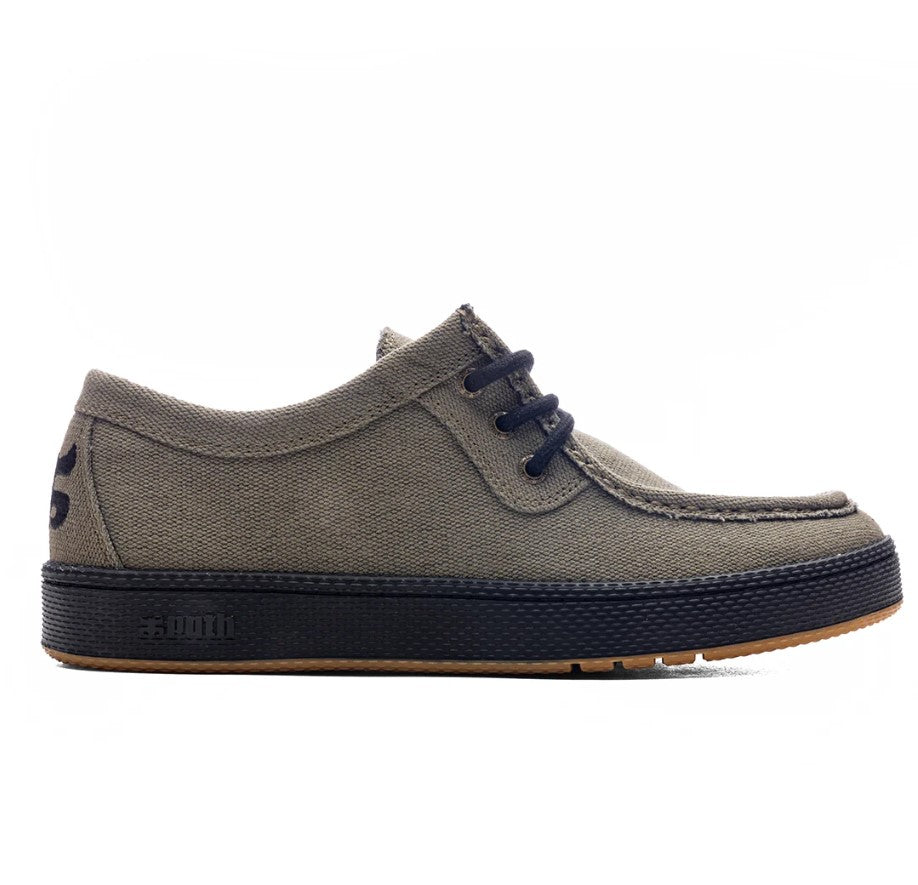 Olive green shoe with black laces and sole on a white background