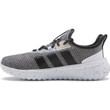 Gray and black Adidas sneaker on a white background