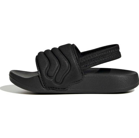 Black sandal with a strap on a white background