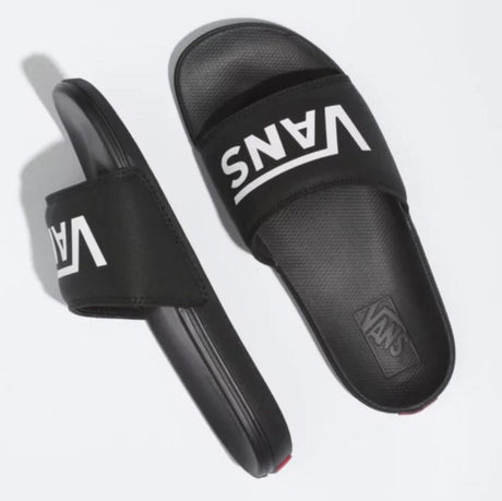 Black slides with Vans logo on a white background