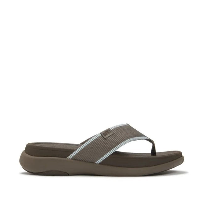 Brown sandal with a brown and light blue strap on a white background