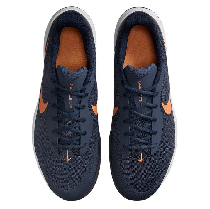 pair of navy Nike shoes with an orange-bronze swoosh on each side from a top down view