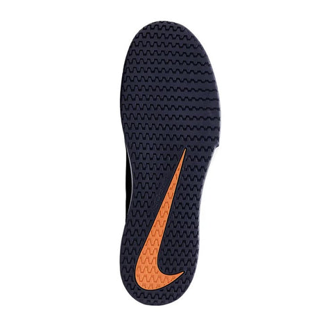 A navy coloured shoe sole with an orange swoosh incorporated into the tread pattern