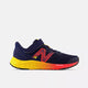 Navy running shoe with red and yellow accents on a light gray background