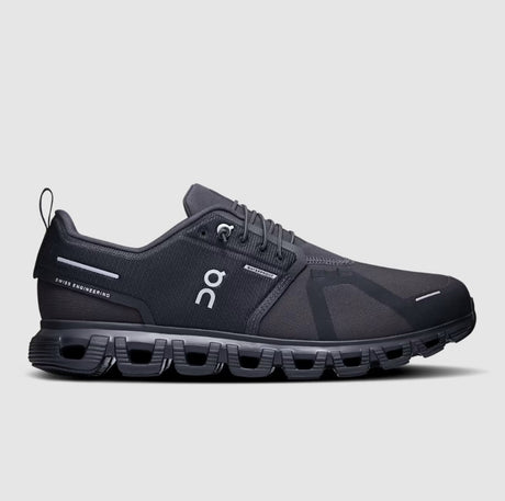 Black running shoe with visible brand logo on a light gray background