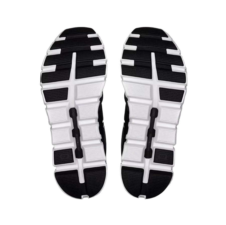 Black and white sole of a shoe on a light gray background