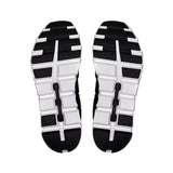 Black and white sole of a shoe on a light gray background