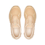 Pair of beige sneakers on a white background