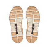 beige and peach shoe soles on a white backgoround