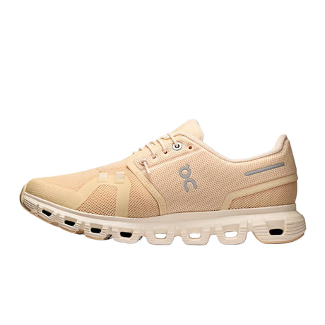 Beige running shoe with a visible brand logo on a white background