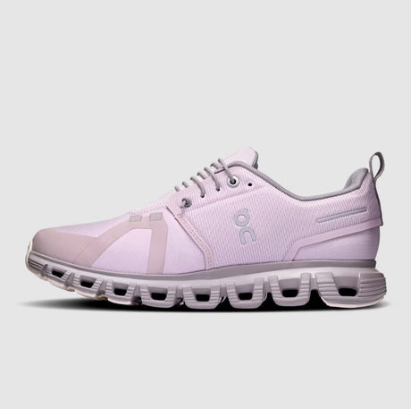Light purple running shoe with a visible brand logo on a light gray background