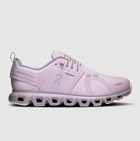 Pink running shoe on a light gray background