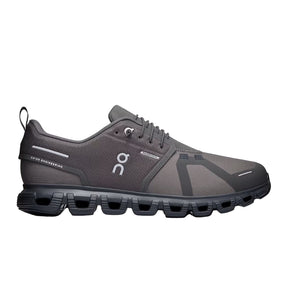 Gray running shoe with black sole on a light gray background