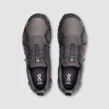 Pair of gray shoes with black accents on a light gray background