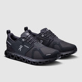 Pair of black athletic shoes on a light gray background