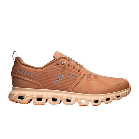 Brown/orange running shoe with a unique sole design on a white background