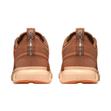 Brown athletic shoes with a visible brand logo on a white background