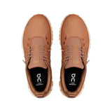 Pair of brown shoes with a visible brand logo on a white background