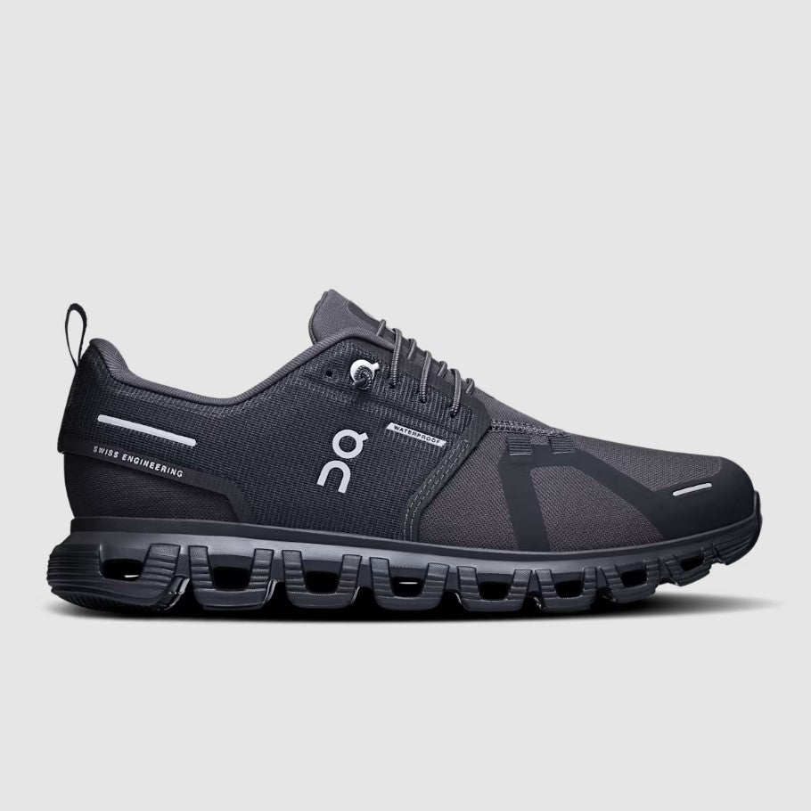 Black running shoe with visible brand logo on a light gray background