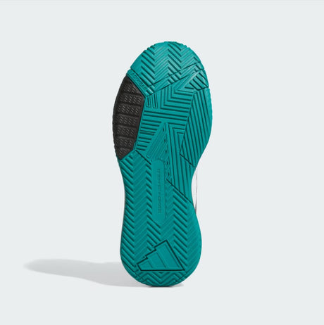 Teal shoe sole with a textured pattern on a light gray background