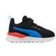 A Puma sneaker for kids in black, featuring a bright blue formstrip, a red heel accent, and a white midsole, shown against a plain white background.