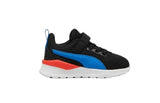 A Puma sneaker for kids in black, featuring a bright blue formstrip, a red heel accent, and a white midsole, shown against a plain white background.
