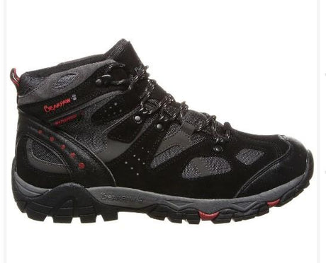 Black hiking boot with red accents on a white background