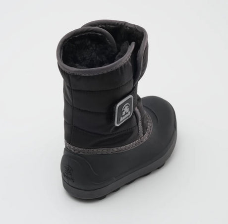 a black kamik boot from the back, featuring a black rubber sole and black fur lining