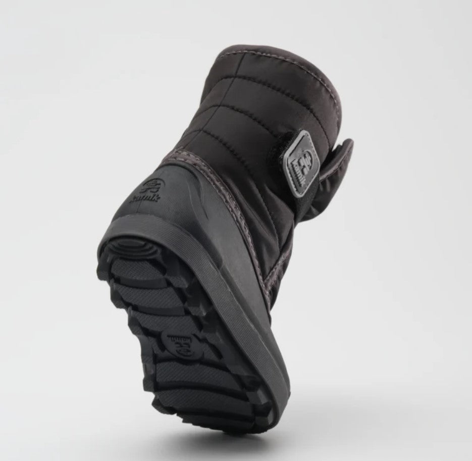 Bottom sole of a black Kamik toddler boot, featuring a black rubber bottom