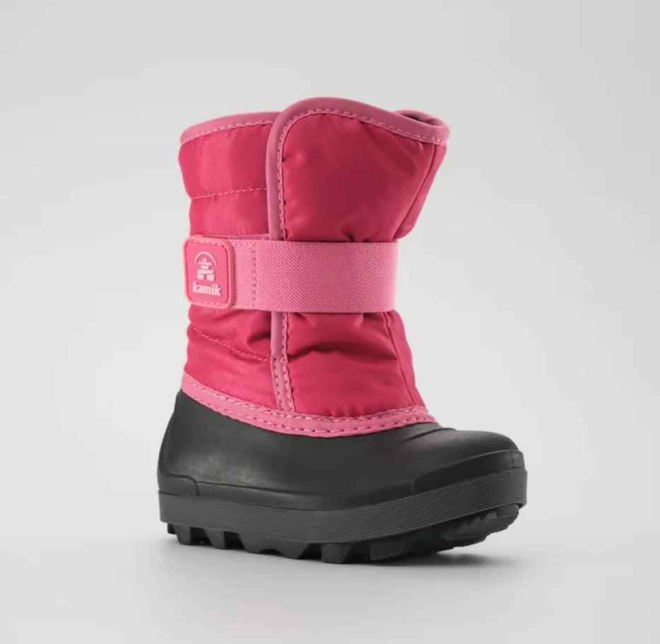 a bright pink kamik boot from the side, featuring a black rubber foot bed