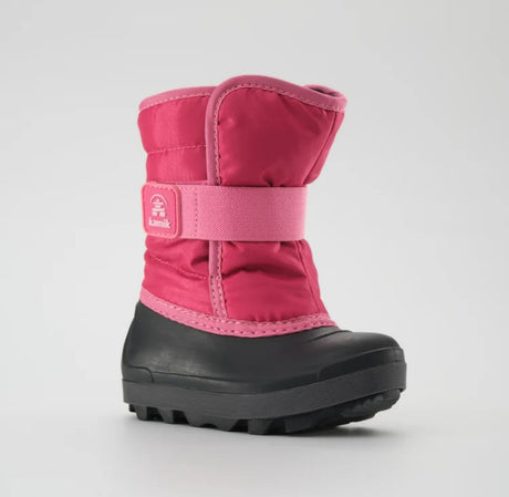 a bright pink kamik boot from the side, featuring a black rubber foot bed
