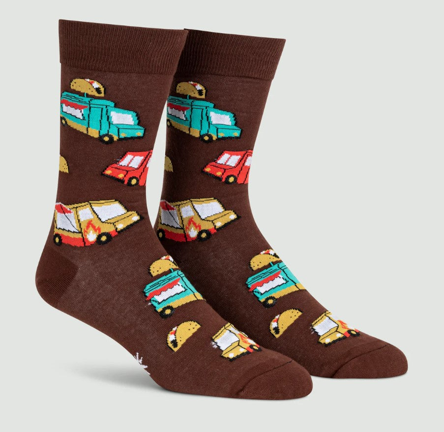 Brown socks with colorful food truck and taco designs on a light gray background