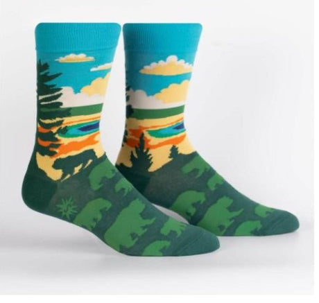 Pair of socks with nature-themed design on a white background